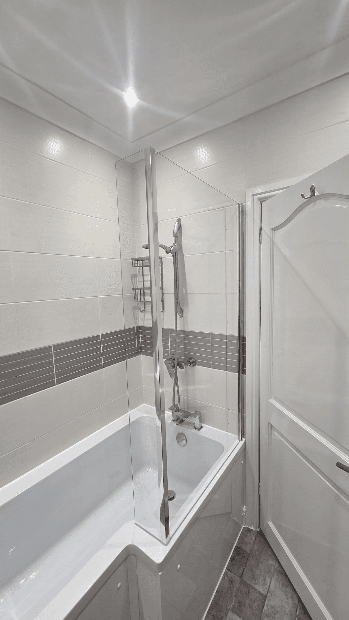 Bath with glass shower screen installation