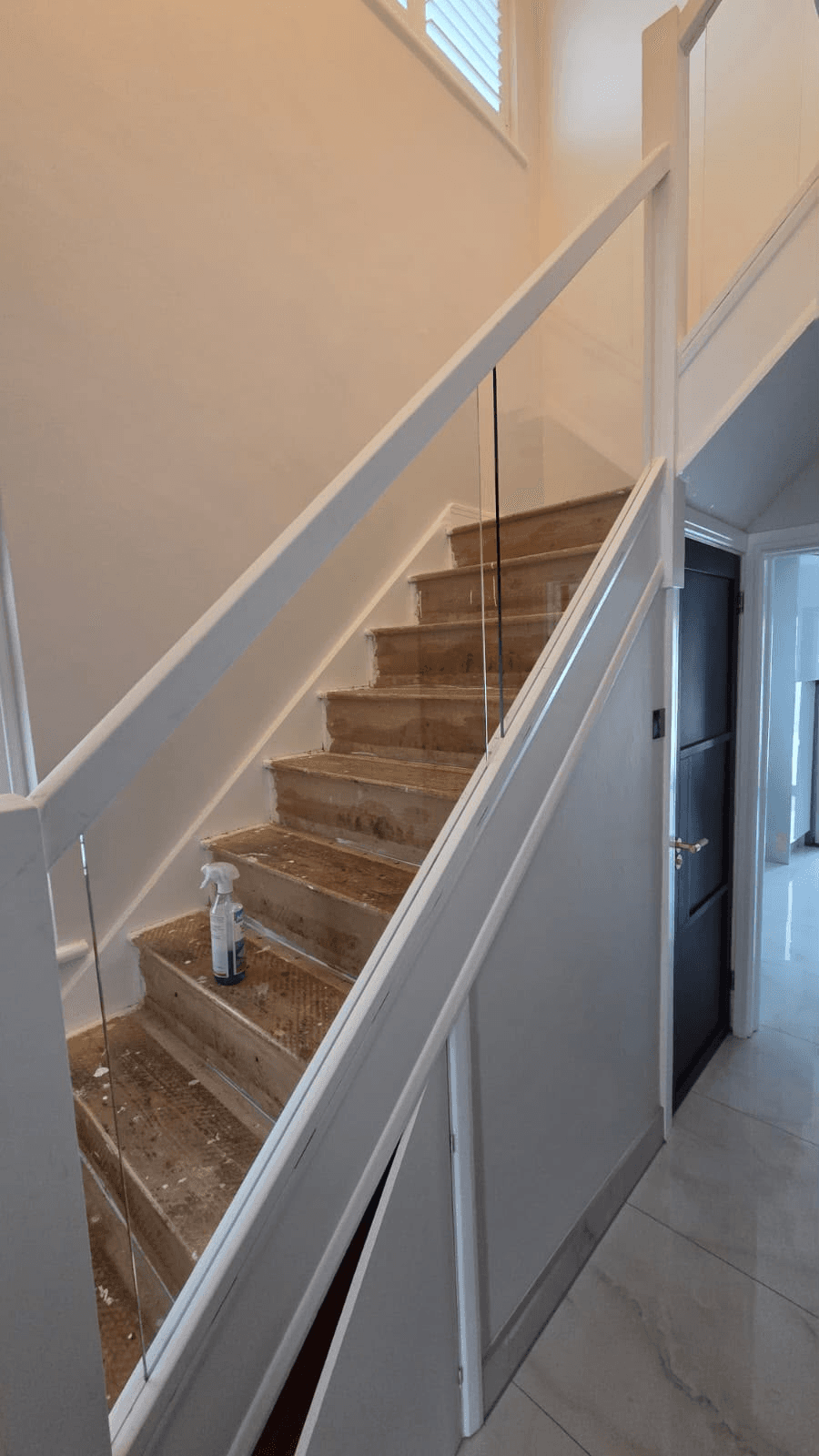 Glass balustrade installation on staircase