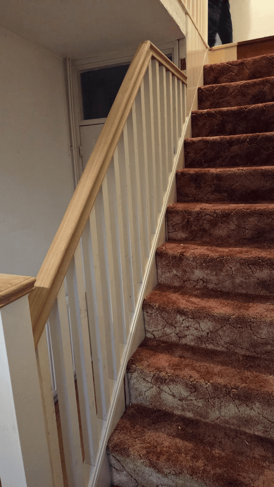 Newly fitted staircase with oak banister