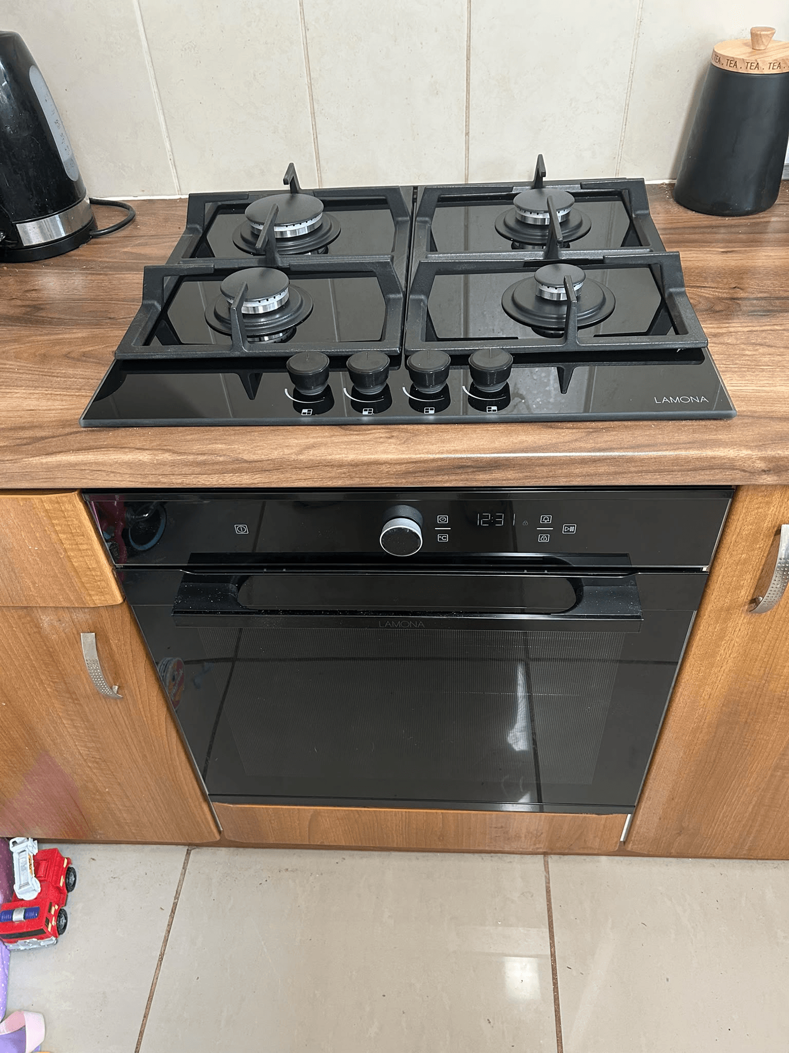Gas hob and oven installed in kitchen