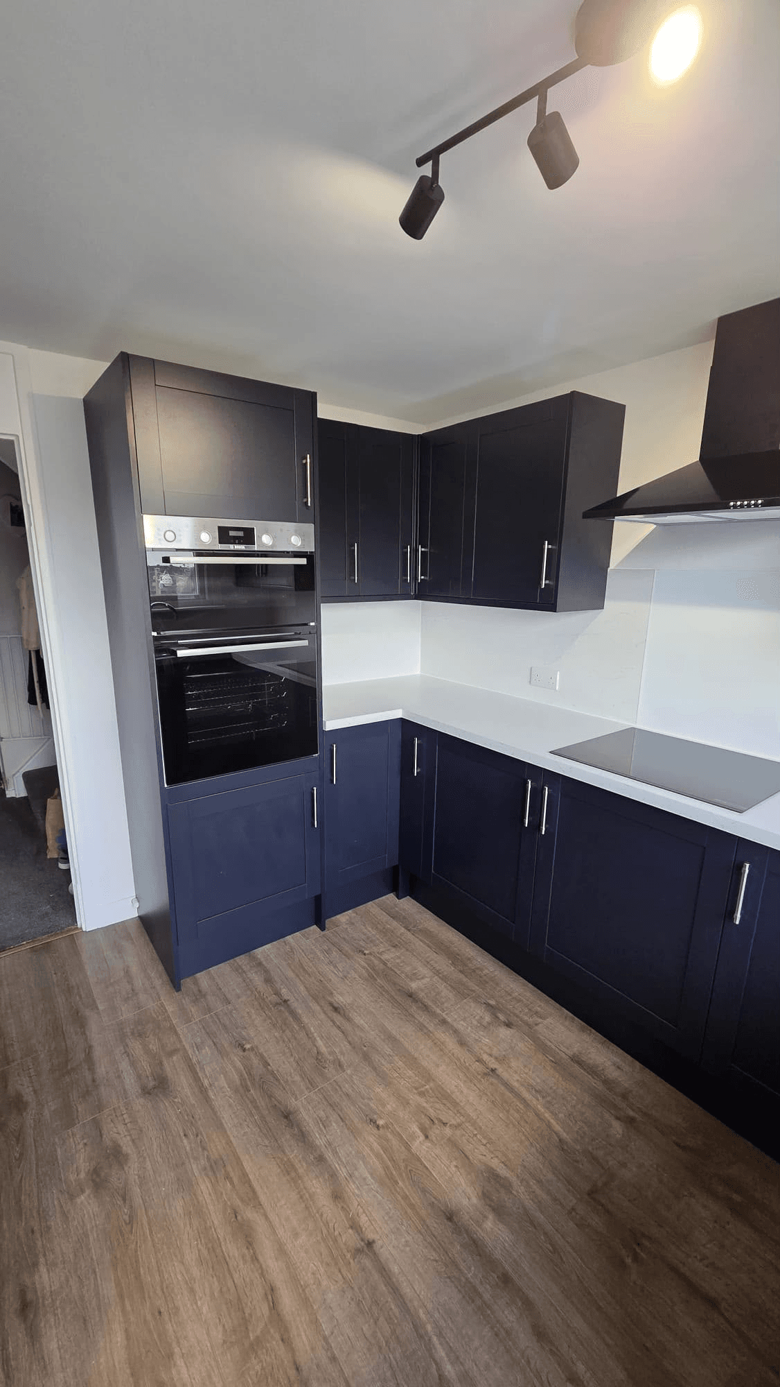 Navy kitchen with integrated oven